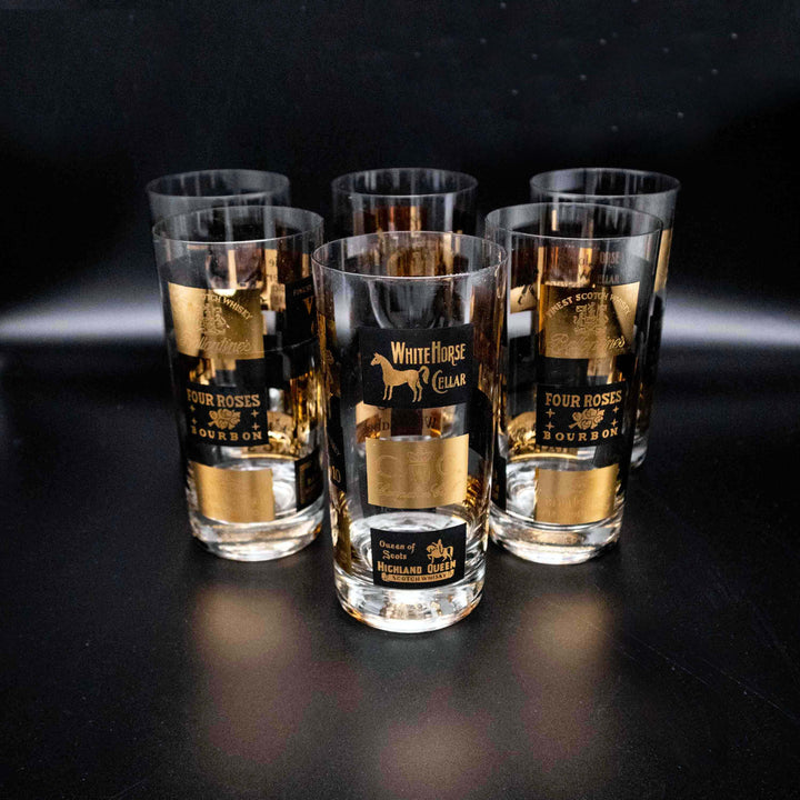 Set aus 6 Longdrinkgläser mit Schwarz-Gold Spirituosen-Dekor, hintereinander